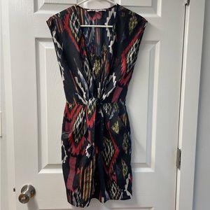 Pattered shirt dress with full front button and tie detail with pockets!